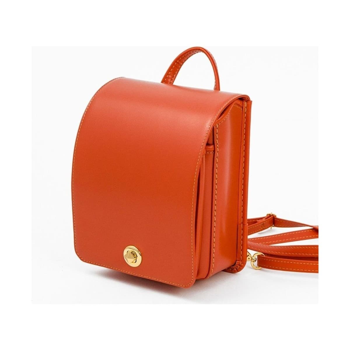 Tangerine Mini Ransel — front three-quarter view with straps.