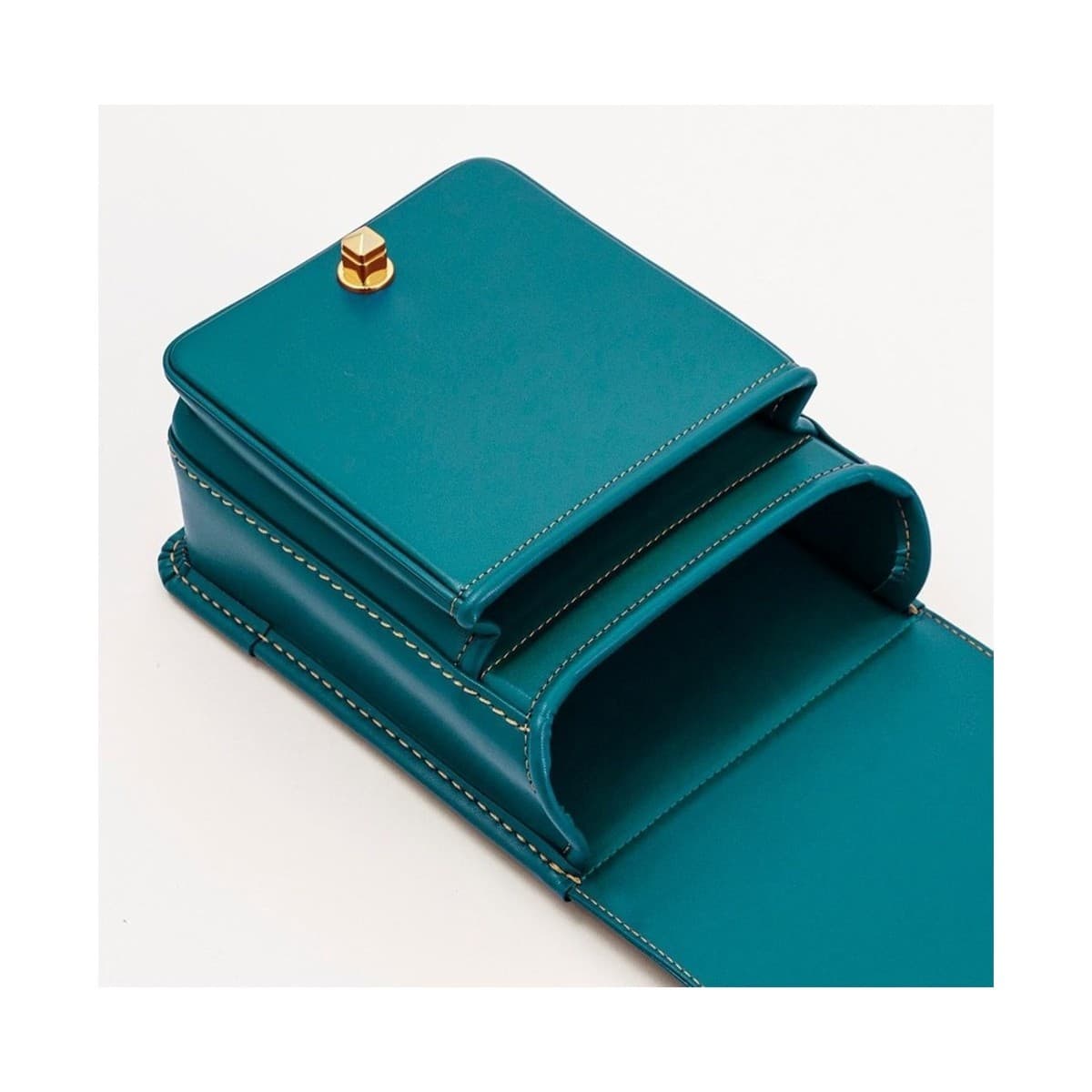 Teal Mini Ransel — open lid revealing the matching teal interior.