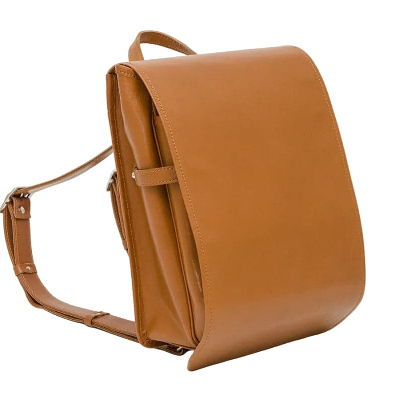 The Sufuria Adult Series in Camel Tan — front three-quarter view showing the clean leather body and twin belts.
